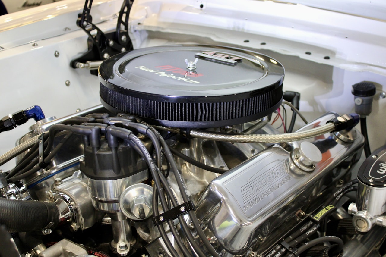 Chrome engine components in a classic car engine bay