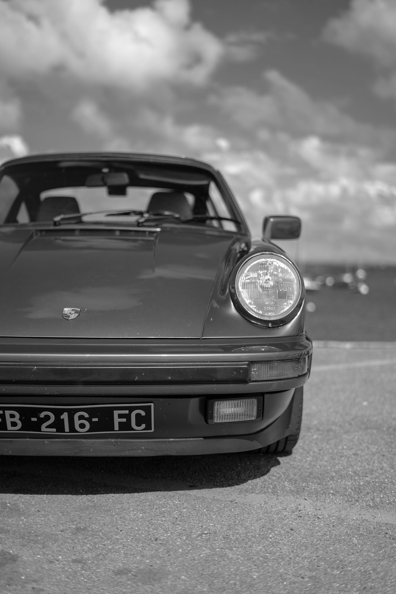 Classic Porsche 911 in profile, showing the distinctive sloping roofline and rear-engine proportions