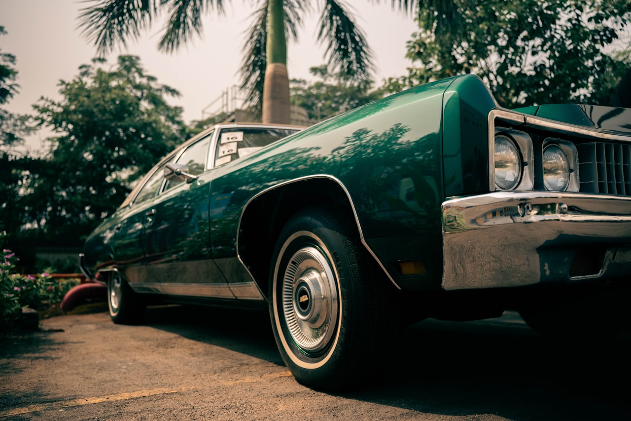 Vintage green car showing rubber seals and weatherstripping around door frames
